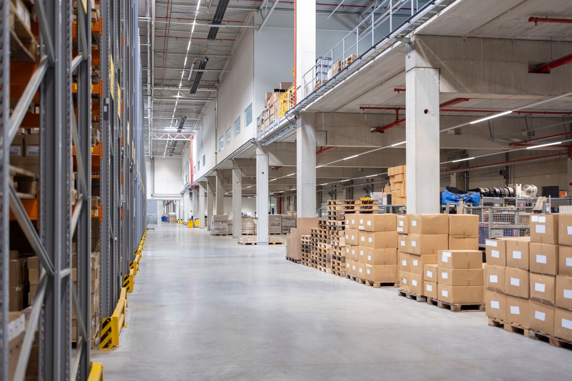 Distribution warehouse with stacked boxes and storage racks